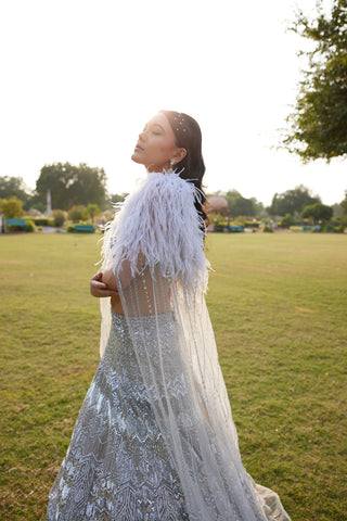 "Seher" Silver Grey Metallic Sequin & Crystal Beads Hand Embroidered Lehenga Set With Cape "Seher" Silver Grey Metallic Sequin & Crystal Beads Hand Embroidered Lehenga Set With Cape