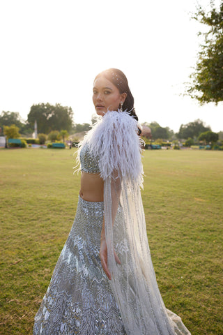 "Seher" Silver Grey Metallic Sequin & Crystal Beads Hand Embroidered Lehenga Set With Cape "Seher" Silver Grey Metallic Sequin & Crystal Beads Hand Embroidered Lehenga Set With Cape