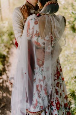 Bride in white with flower embroidery - Dina Kashap